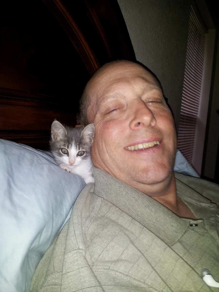 Baby Spitz on Brad's shoulder
